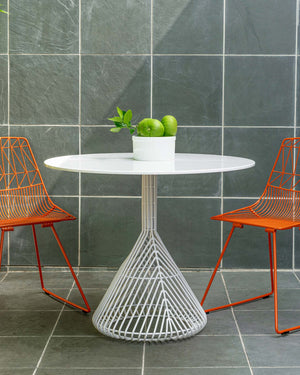 Bend Goods Store offers a variety of modern table designs, this is a side table made from wire with a glass top. Also available are dining tables, center tables and coffee tables.